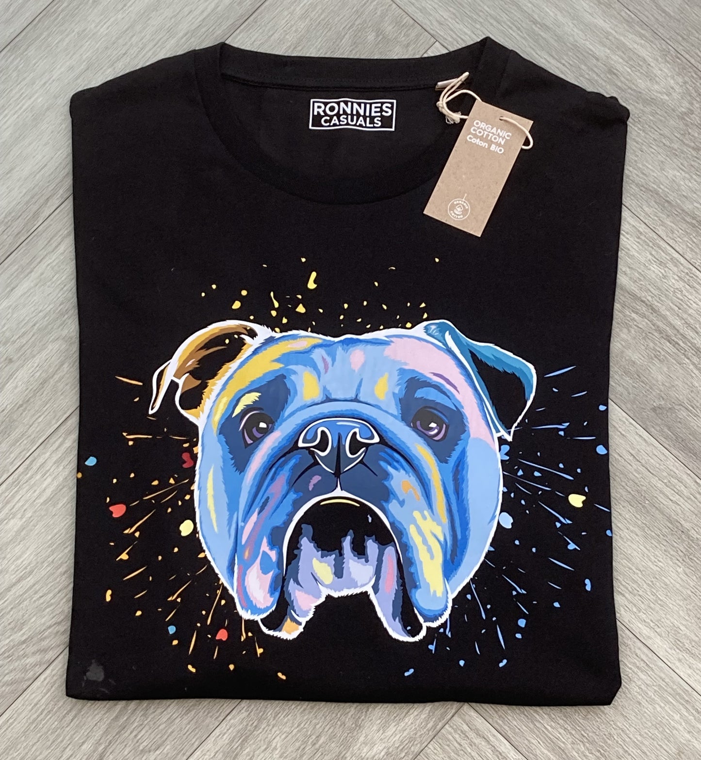 Colourful Bulldog dog face in bright colours, printed onto the front of a black t-shirt