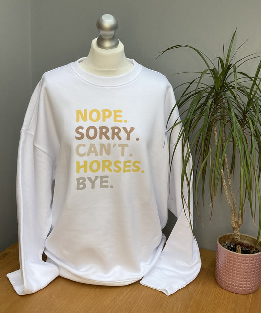 White Sweatshirt with Nope, Sorry, Can't, Horses, Bye printed on the front with bright colours